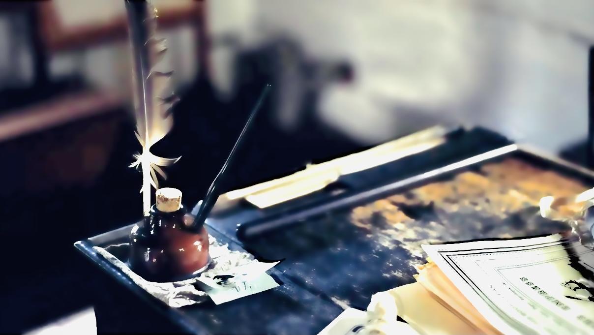 Quill pen and inkwell on the notary’s writing desk